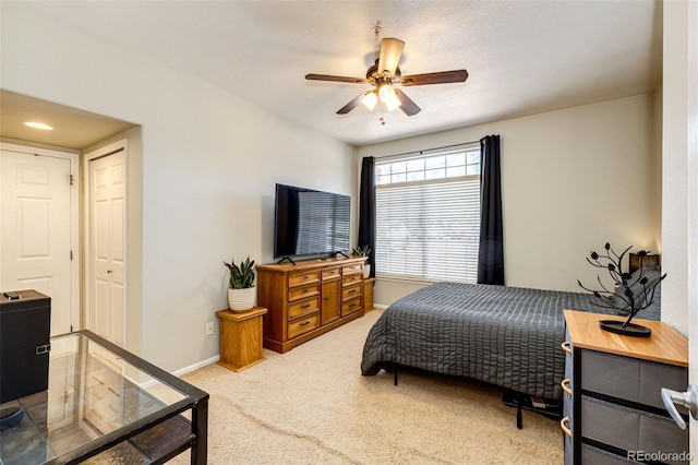 452 Black Feather Loop Unit 608, Castle Rock, CO 80104 - bedroom featuring light colored carpet, baseboards, and ceiling fan