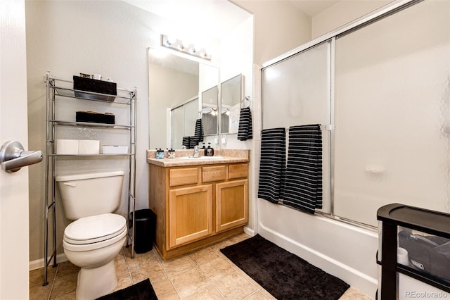 452 Black Feather Loop Unit 608, Castle Rock, CO 80104 - bathroom featuring vanity, bath / shower combo with glass door, and toilet