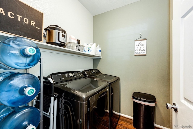 452 Black Feather Loop Unit 608, Castle Rock, CO 80104 - laundry room featuring washer and clothes dryer, wood finished floors, and baseboards