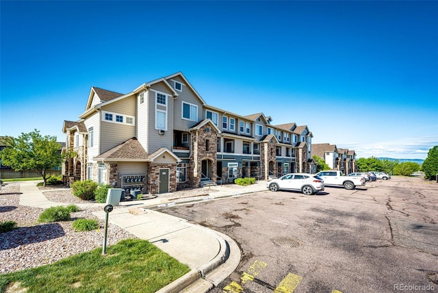 452 Black Feather Loop Unit 608, Castle Rock, CO 80104 - view of property with uncovered parking and a residential view