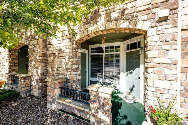 452 Black Feather Loop Unit 608, Castle Rock, CO 80104 - property entrance with stone siding and covered porch