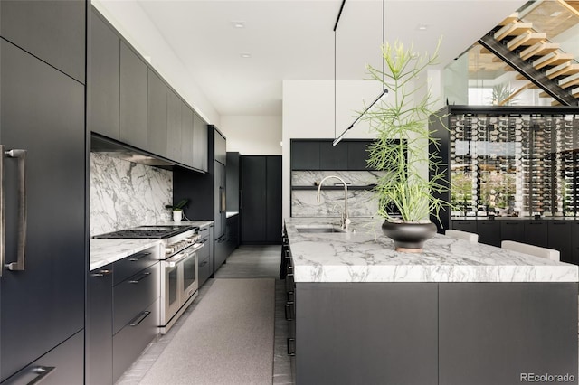140 S Glencoe St, Denver, CO 80246 - kitchen featuring high quality appliances, modern cabinets, backsplash, and extractor fan