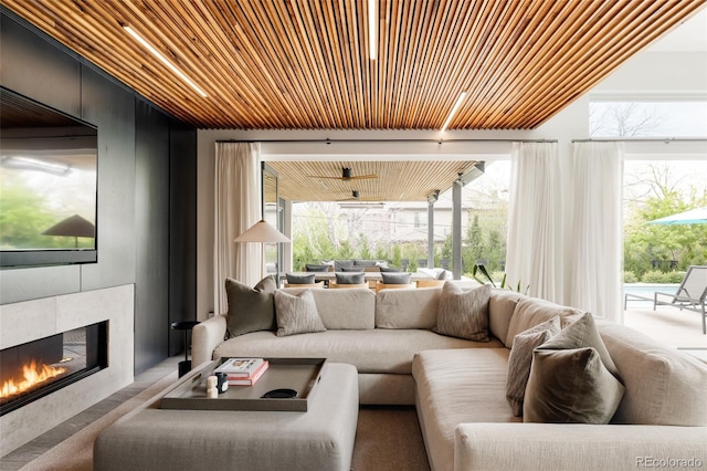 140 S Glencoe St, Denver, CO 80246 - living area featuring wooden ceiling and a tiled fireplace