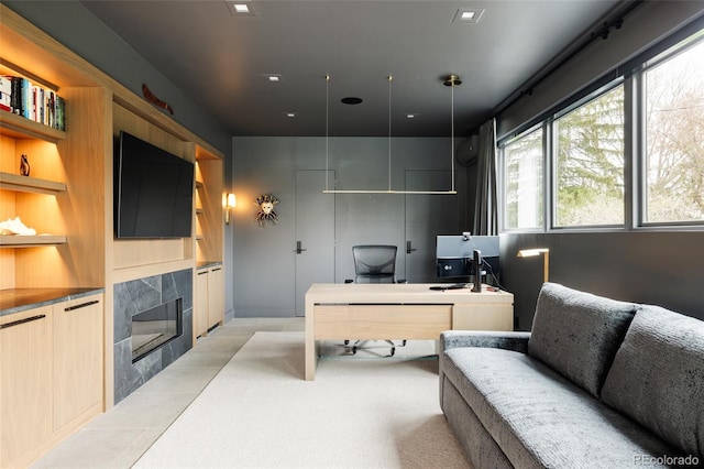 140 S Glencoe St, Denver, CO 80246 - office featuring a tile fireplace, built in shelves, and light tile patterned floors