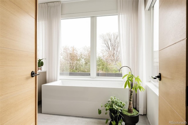 140 S Glencoe St, Denver, CO 80246 - bathroom featuring plenty of natural light and a bathtub
