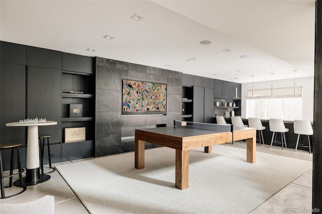 140 S Glencoe St, Denver, CO 80246 - rec room with built in shelves and concrete flooring
