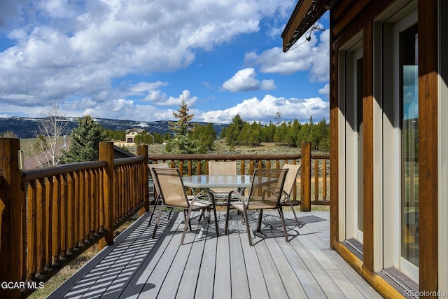 62 897, Grand Lake, CO 80447 - wooden deck featuring outdoor dining area and a mountain view