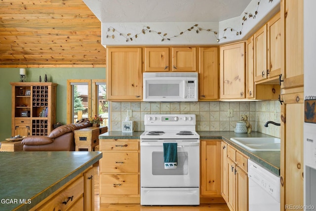 62 897, Grand Lake, CO 80447 - kitchen with white appliances, dark countertops, decorative backsplash, and light brown cabinetry