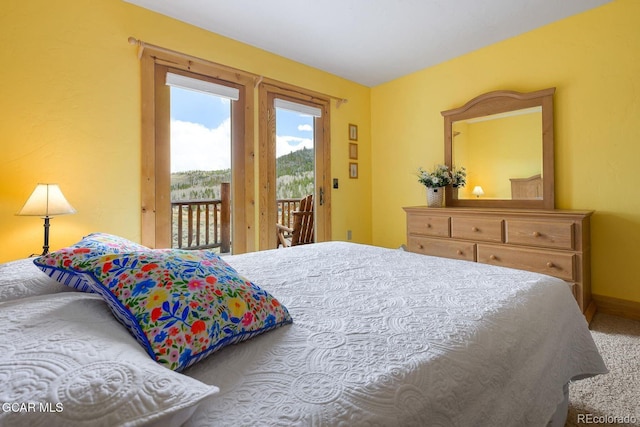 62 897, Grand Lake, CO 80447 - carpeted bedroom featuring access to outside and baseboards
