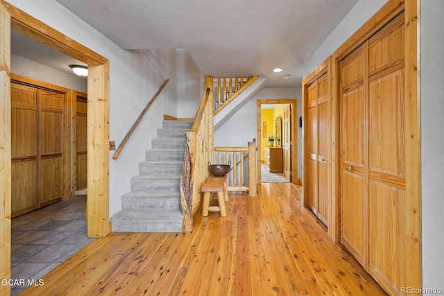 62 897, Grand Lake, CO 80447 - entryway with recessed lighting, stairs, and light wood finished floors