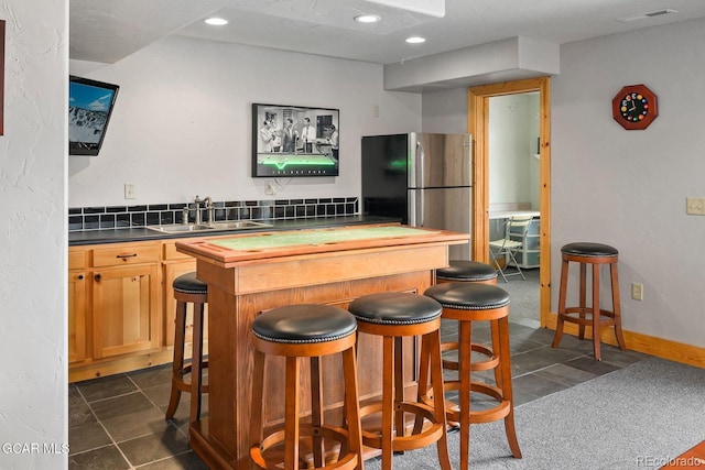 62 897, Grand Lake, CO 80447 - indoor bar with freestanding refrigerator, recessed lighting, and dark tile patterned flooring