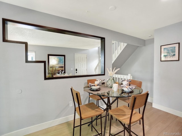 453 Arden Cir, Highlands Ranch, CO 80126 - dining space featuring stairway and light wood-type flooring