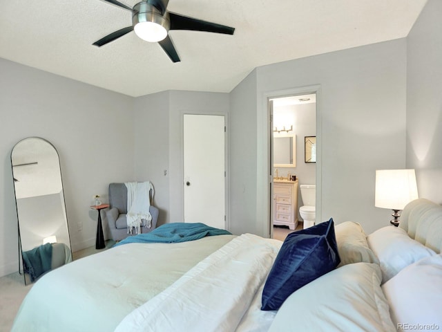 453 Arden Cir, Highlands Ranch, CO 80126 - bedroom featuring ensuite bath, light carpet, and a ceiling fan