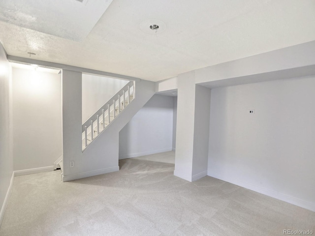 453 Arden Cir, Highlands Ranch, CO 80126 - finished basement with carpet, stairway, and a textured ceiling