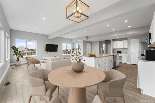 dining area with beam ceiling, recessed lighting, visible vents, wood finished floors, and baseboards