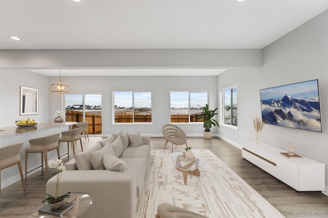 living area with dark wood-style floors, recessed lighting, and baseboards