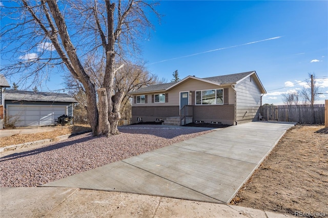 ranch-style house with a garage, an outdoor structure, and fence