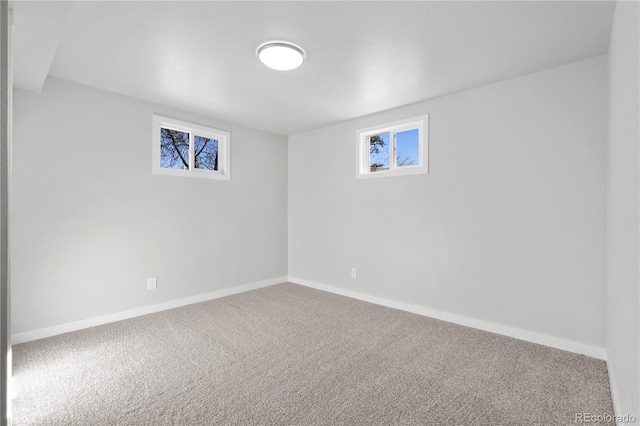 below grade area with carpet and baseboards