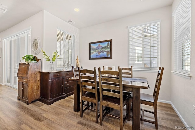 dining room with light hardwood / wood-style floors