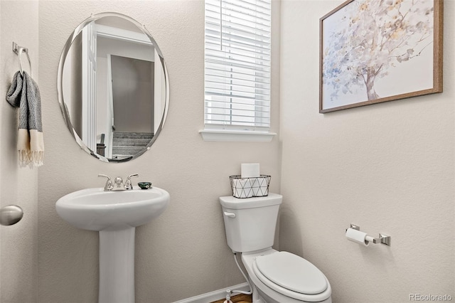 bathroom with sink and toilet