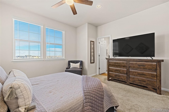 bedroom with light colored carpet and ceiling fan