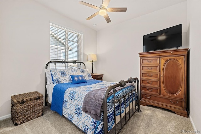 bedroom with light carpet and ceiling fan