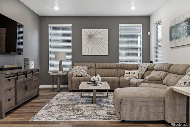 living area featuring dark wood-style floors, recessed lighting, and baseboards