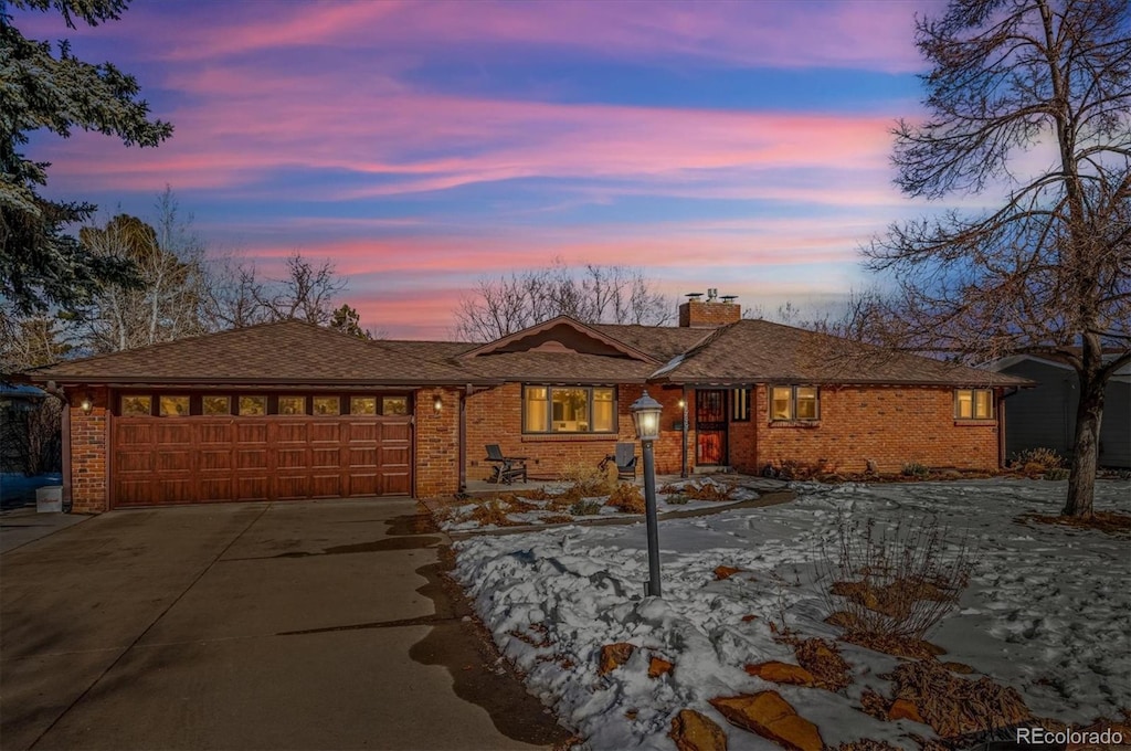 single story home with a garage