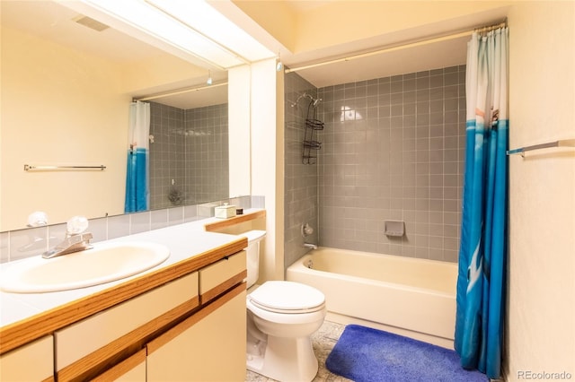 9400 E Iliff Ave Unit 411, Denver, CO 80231 - bathroom featuring vanity, toilet, shower / bath combo with shower curtain, and tile patterned flooring