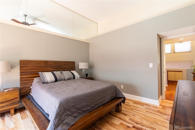 9400 E Iliff Ave Unit 411, Denver, CO 80231 - bedroom with light wood-style flooring and baseboards