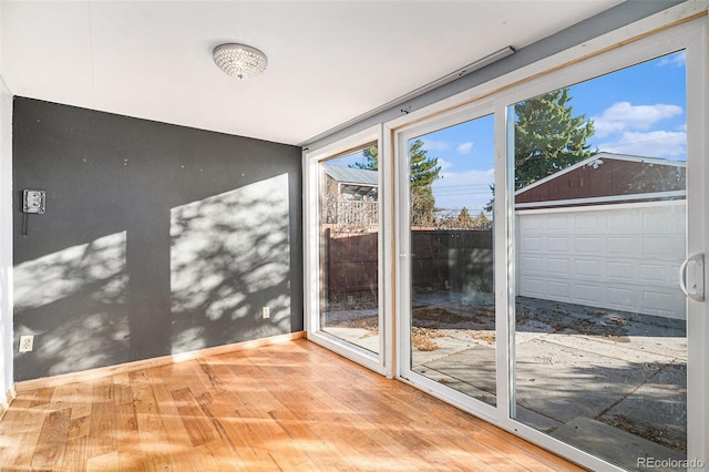 doorway to outside featuring wood-type flooring