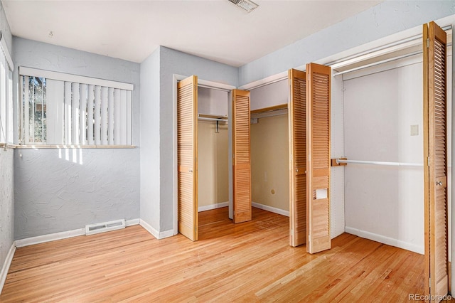 unfurnished bedroom featuring hardwood / wood-style floors