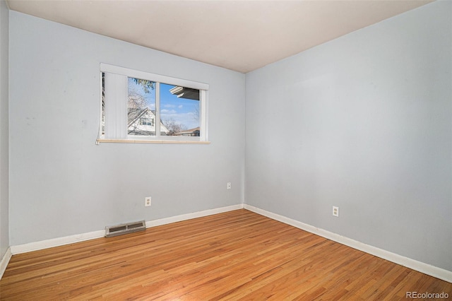 unfurnished room featuring light hardwood / wood-style floors