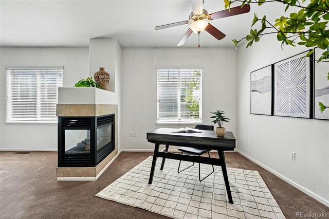 13020 Grant Cir W Unit A, Thornton, CO 80241 - office area with carpet flooring, a multi sided fireplace, a ceiling fan, and baseboards