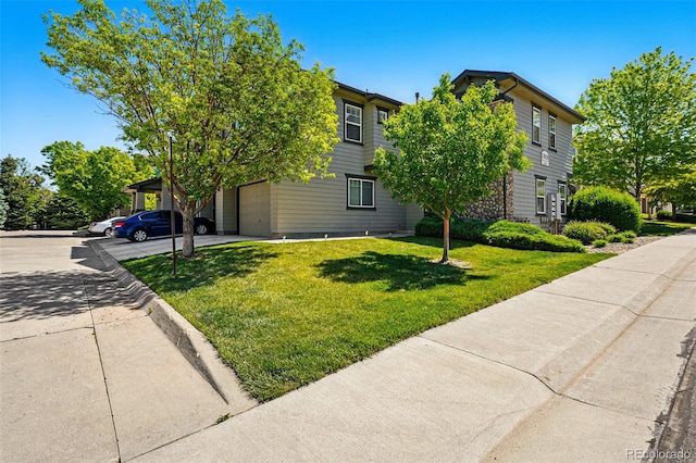13020 Grant Cir W Unit A, Thornton, CO 80241 - obstructed view of property with concrete driveway, a front yard, and a carport