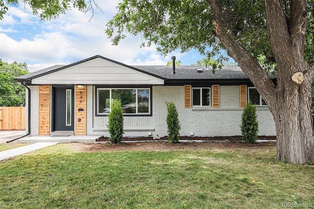530 Everett St, Lakewood, CO 80226 - view of front of home with brick siding and covered porch