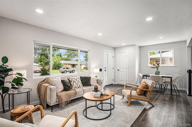 530 Everett St, Lakewood, CO 80226 - living room featuring healthy amount of natural light, wood finished floors, recessed lighting, and a textured ceiling
