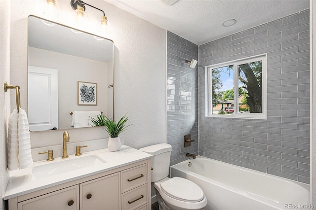 530 Everett St, Lakewood, CO 80226 - full bathroom featuring vanity, shower / bath combination, a textured ceiling, and a textured wall