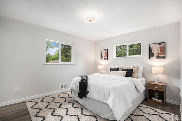 530 Everett St, Lakewood, CO 80226 - bedroom with multiple windows and wood finished floors