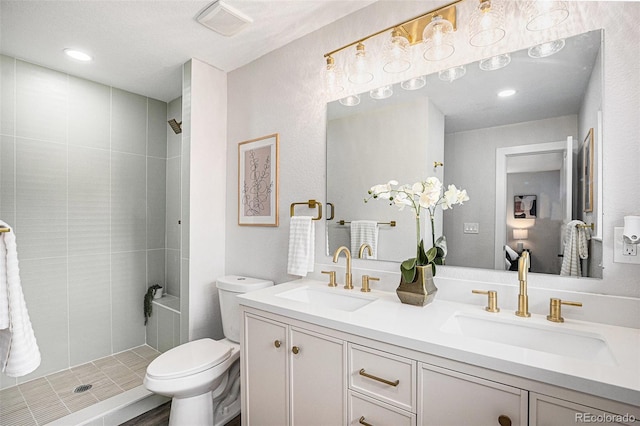 530 Everett St, Lakewood, CO 80226 - full bath with double vanity, tiled shower, and recessed lighting