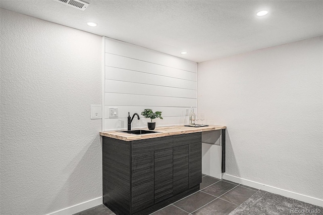 530 Everett St, Lakewood, CO 80226 - bathroom featuring vanity, recessed lighting, a textured wall, tile patterned flooring, and a textured ceiling