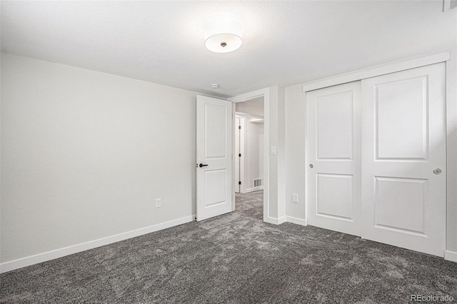 530 Everett St, Lakewood, CO 80226 - unfurnished bedroom with dark carpet and a closet