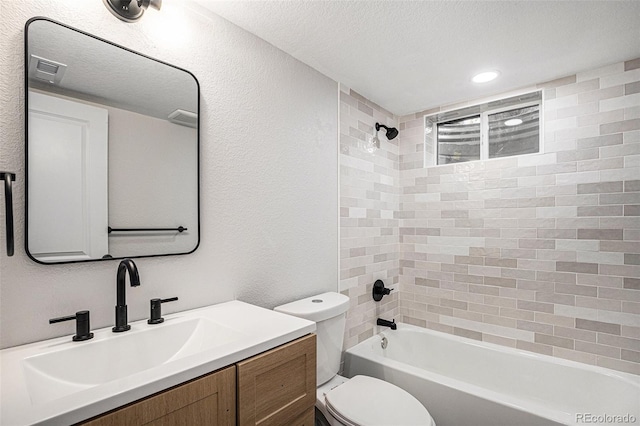 530 Everett St, Lakewood, CO 80226 - bathroom with vanity, tub / shower combination, a textured wall, a textured ceiling, and recessed lighting