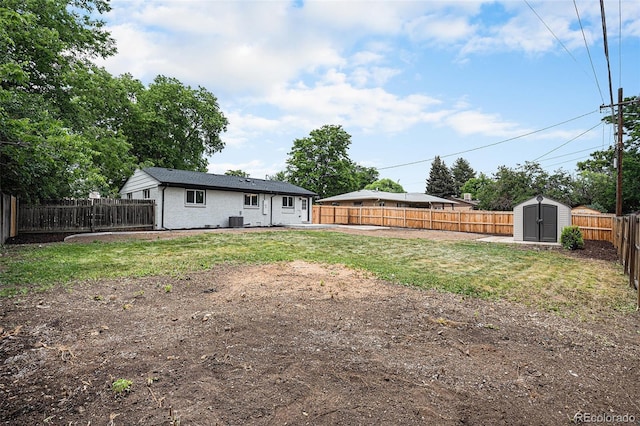 530 Everett St, Lakewood, CO 80226 - fenced backyard featuring a storage unit