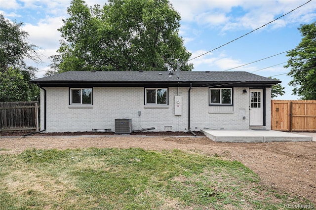 530 Everett St, Lakewood, CO 80226 - rear view of property with brick siding and a patio