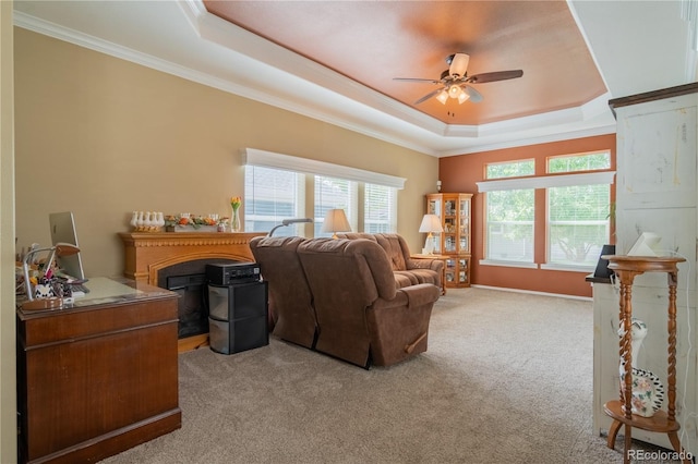 7885 Buckhorn Grn Unit 131, Frederick, CO 80530 - living area with a tray ceiling, a ceiling fan, light carpet, plenty of natural light, and ornamental molding