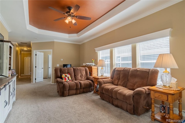 7885 Buckhorn Grn Unit 131, Frederick, CO 80530 - living area featuring a tray ceiling, light carpet, ceiling fan, and crown molding