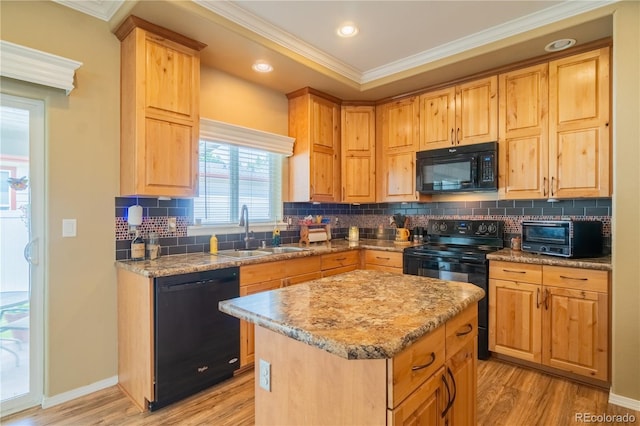 7885 Buckhorn Grn Unit 131, Frederick, CO 80530 - kitchen featuring black appliances, crown molding, light wood-type flooring, light stone counters, and recessed lighting