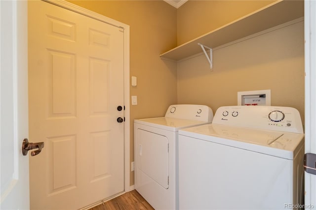 7885 Buckhorn Grn Unit 131, Frederick, CO 80530 - washroom featuring washing machine and clothes dryer and light wood finished floors