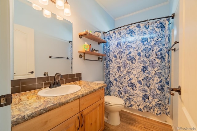 7885 Buckhorn Grn Unit 131, Frederick, CO 80530 - bathroom featuring wood finished floors, crown molding, vanity, decorative backsplash, and a shower with shower curtain